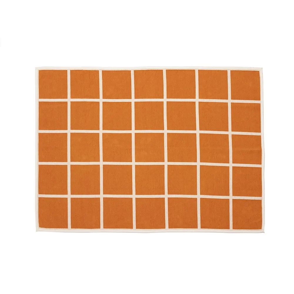 Vevd pledd i lammeull Criss Pale Orange