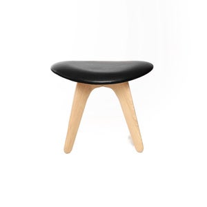 Slab ottoman natur svart skinn